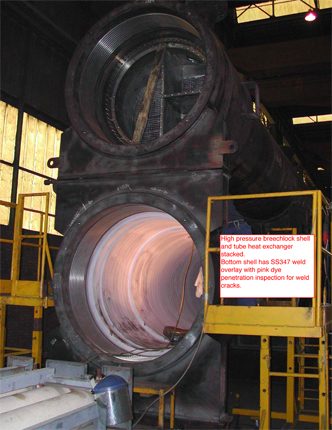 High pressure breechlock shell and tube heat exchangers stacked in the fabrication shop, lower shell with SS347 weld overlay